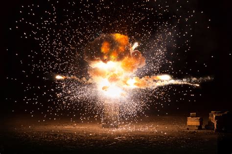 Realistic Fiery Explosion Busting Over A Black Background Stock Photo