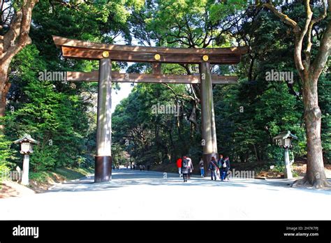 A Huge Wooden Torii Gate Is At The Entrance To The Meiji Jingu Shrine