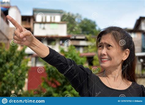 filipina female senior pointing foto de archivo imagen de maduro jubilado 137573752
