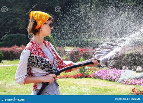 Woman Watering The Flowers Stock Photo Image Of Gardening 59669884