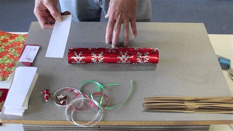 Take your wrapping paper, a snap, and the cardboard tube. How to make Christmas Crackers by Olde English Crackers ...