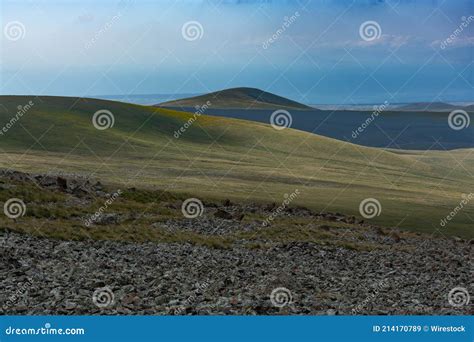 Closeup Shot Of A Rocky Hill Covered In Greenery At Daytime Stock Image