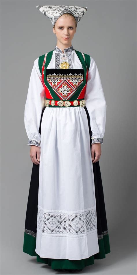 The vigra bunad worn with the red stockings and red embroidery on the head kerchief signals this woman is not married. Voss bunad, Hordaland, for married woman | Norwegian dress ...