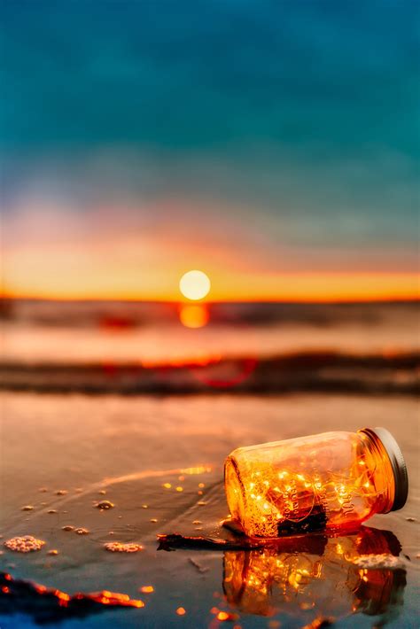 Pick a bottle without any visible seams, flaws, or raised lettering to display you can skip this step if your bottle is already clean or if it came with your ship in a bottle kit. Bottle with ship on the beach at sunset image - Free stock ...