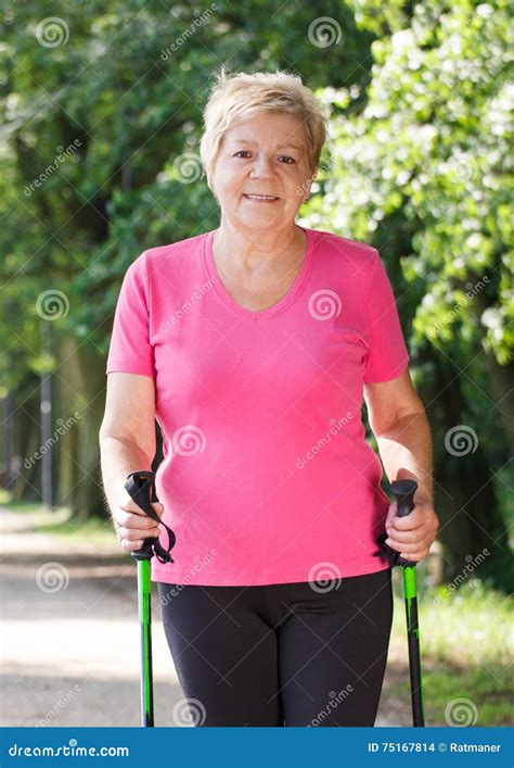Elderly Senior Woman Practicing Nordic Walking Sporty Lifestyles In
