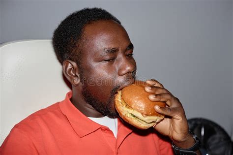 Black Man Eating Burger Stock Photos Free Royalty Free Stock Photos From Dreamstime