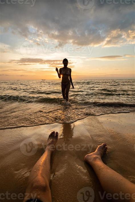 Woman Silhouette On The Beach At Sunset With Man Legs Stock Photo At Vecteezy