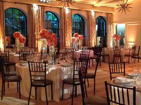 Hotel Ballroom Transformed With Lighting Peach And Coral Centerpieces