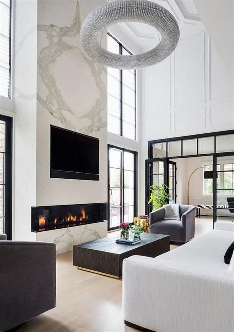 Two Story White Marble Fireplace With Tv Niche Modern Living Room