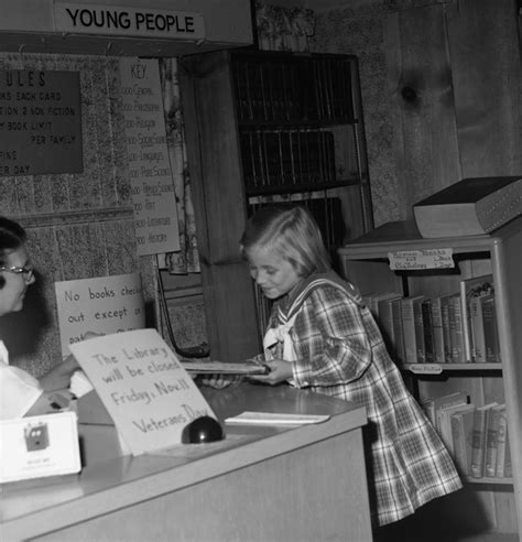 Florida Memory Girl Checking Out Book At The Leon County Public