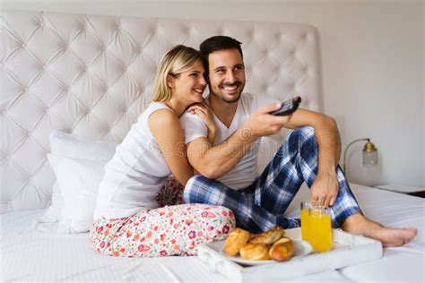 Young Couple Having Having Romantic Times In Bedroom Stock Photo