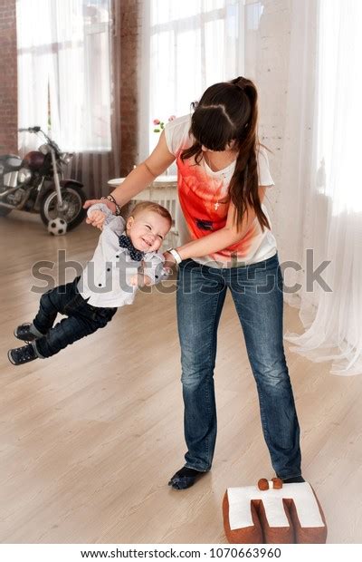Mom Shakes Baby By Hands He Stock Photo 1070663960 Shutterstock