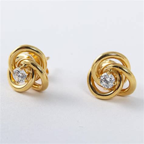 Pair Of Tiffany And Co 18 Karat Yellow Gold Love Knot Diamond Earrings