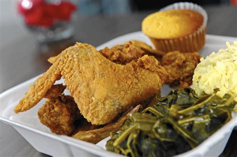Natural light fills the space and its lights strung across the ceiling and white walls interrupted with. Southern flavors shine at Georgia Soul Food in Charles ...