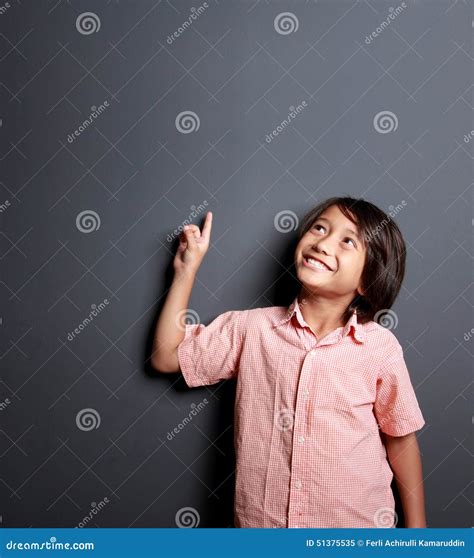 Handsome Little Boy Pointing And Looking Upwards Stock Image Image Of