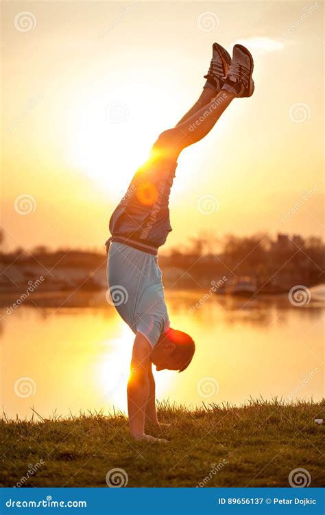 Man Doing Handstands On Sunset Stock Image Image Of Young Grass