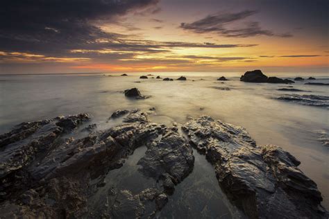 Beach Nature Ocean Rocks Sea Stones Sunrise Sunset 4k Wallpaper