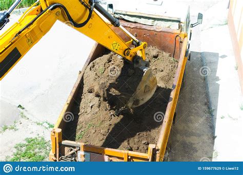 Excavator Is Loading Excavation To The Truck Stock Image Image Of