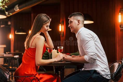 side view romantic couple have dinner in the restaurant stock image image of artificial