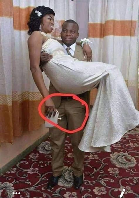 Man Suffers While Lifting His Wife During Wedding Photo