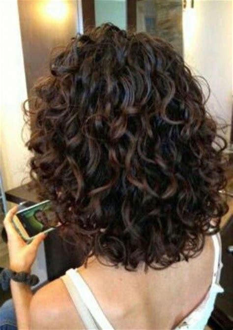 The fringe is kept longer and reaches the chin length while the subtle highlights in golden color blend wonderfully with the natural darker hair color. Chin Length Curly Bob; Short Curly Thick Hair; Short Curly ...