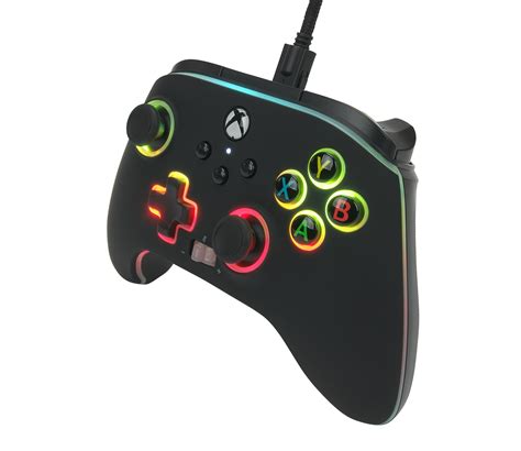A Close Up Of A Game Controller On A White Background With Green And
