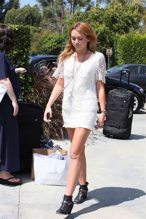 Miley Cyrus Show Her Legs In Short White Dress Going To A Party In