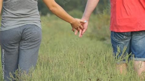 Video Stock Young Couple Joining Hands Outdoor Man And Woman Taking