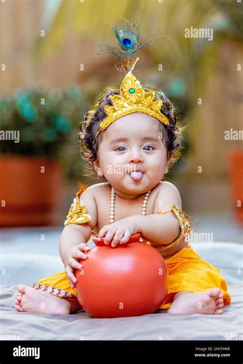 Vertical Shot Of Baby Krishna In Hindu Dress Stock Photo Alamy