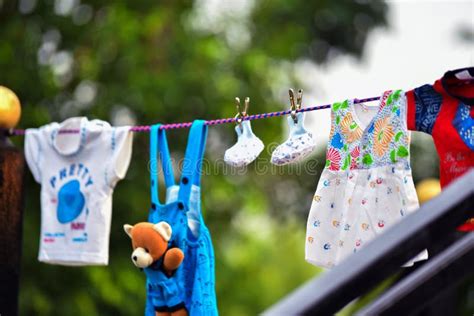 Baby Clothes Hanging On The Clothesline Stock Photo Image Of Baby