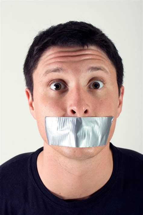 Duct Tape Over Mouth Pretty Black Woman With Duct Tape Over Her Mouth And Holding A Microphone