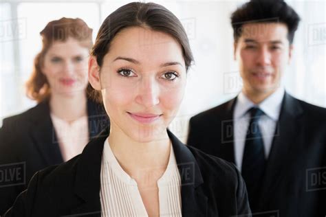 Business People Smiling In Office Stock Photo Dissolve