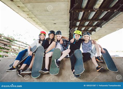 Extreme Sport In City Skateboarding Club For Children Group Friends