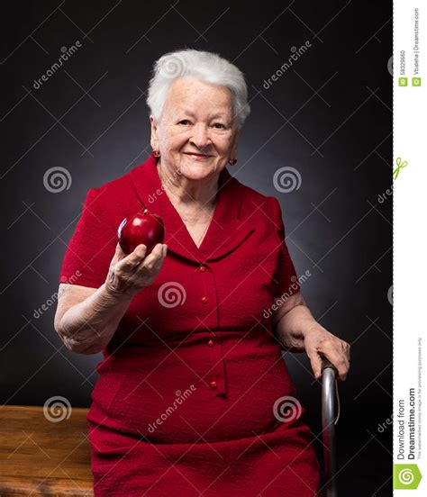 Smiling Old Woman Holding Red Apple Stock Photo Image Of Healthy