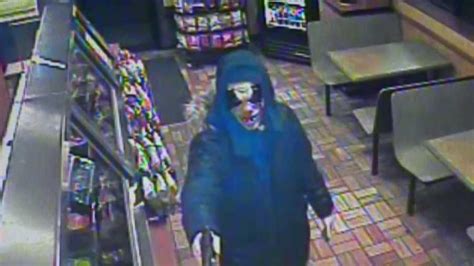 surveillance images clown robber at subway