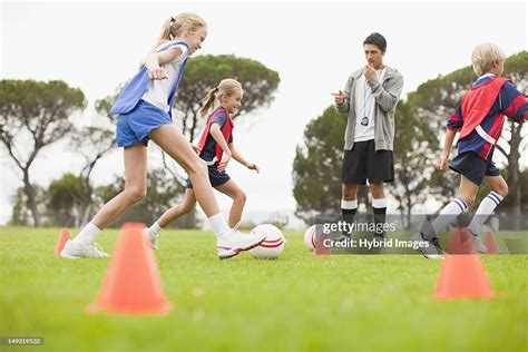 Coach Training Childrens Soccer Team High Res Stock Photo Getty Images