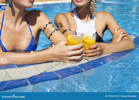 Beautiful Women Drinking A Cocktails While Relaxing By The Swimming Pool Stock Image Image Of