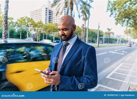 Indian Businessman Wearing Blue Suit Standing Near Office Or Hotel