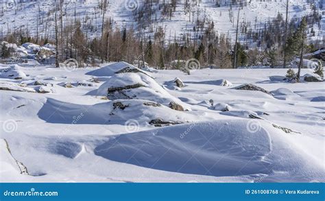 Boulders Lie In Snowdrifts In The Valley Stock Photo Image Of Slope