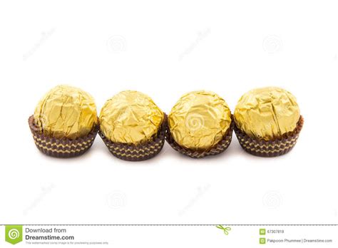 Drop candy coins into clear containers on your gold candy buffet to add a bit of shining color. Sweet Chocolate Balls With Almond Wrapped In Gold Foil ...