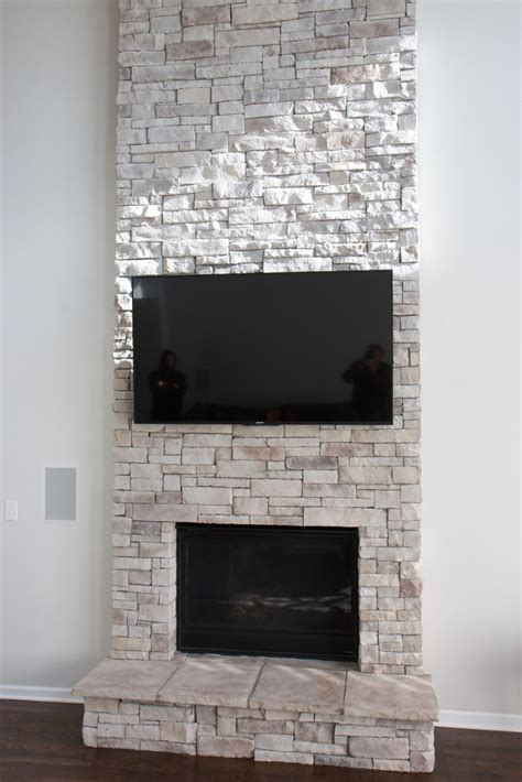 Add fireside ambiance to your backyard with an outdoor fireplace made with stacked stone. Update Your Fireplace! - North Star Stone