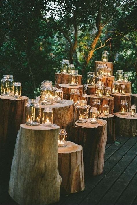 Many Candles Are Lit On Wooden Logs