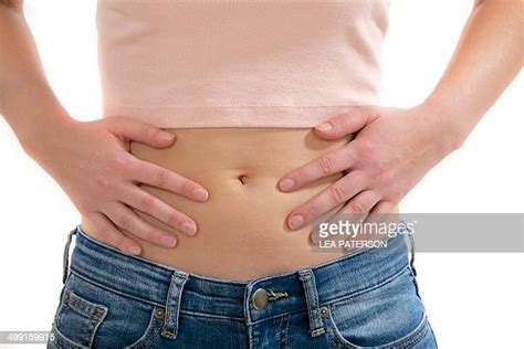 Teenage Girl Touching Stomach Bildbanksfoton Och Bilder Getty Images