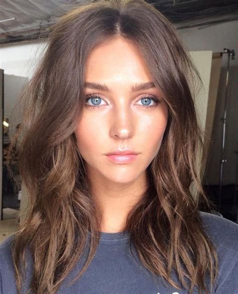 a beautiful girl with blue eyes brown hair shoulder length hair hairstyle beautiful