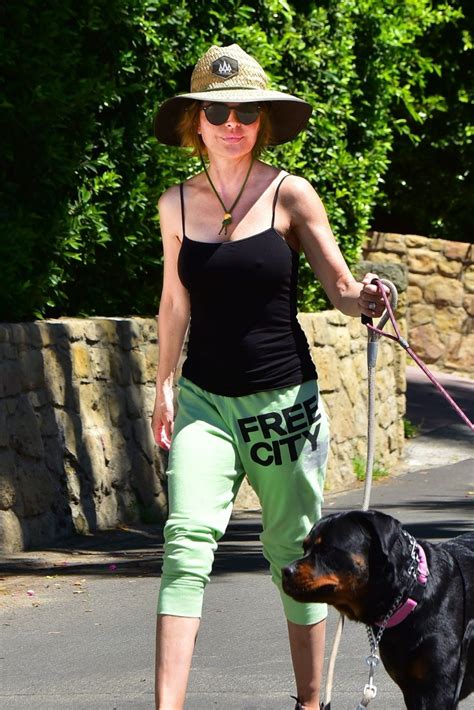 Braless Lisa Rinna Has A Hard Time Holding Her Dogs While Out During A