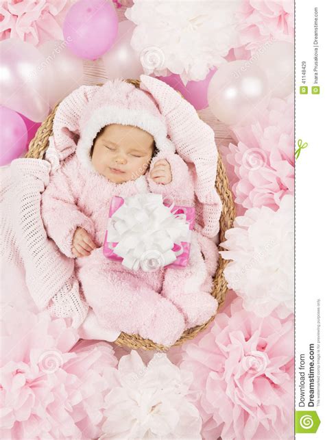 If you think your flowers, balloons, or any gifts falling short to express what you want to tell the baby and the lucky parents then our greetings are here to rescue you from writing the right words on your. Baby Girl With Gift Sleeping, Newborn Child Birthday Stock ...