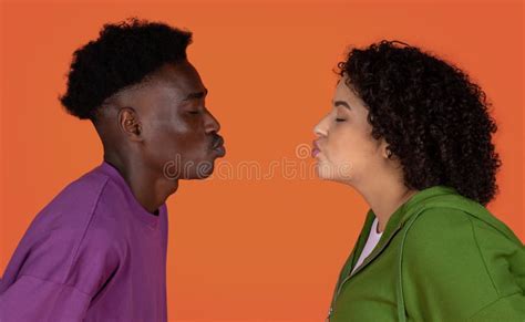 closeup of interracial couple kissing on red copy space stock image image of interracial
