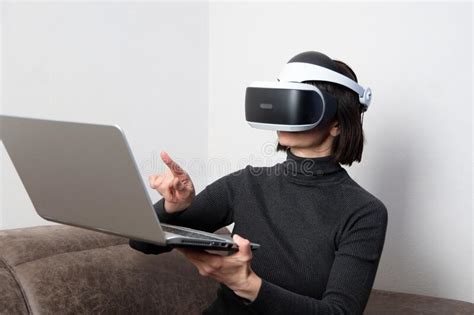 Beautiful Woman Using Vr Headset Shows Something In Laptop Chats With