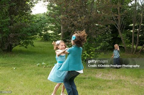 Two Sisters Play Ring Round The Rosie High Res Stock Photo Getty Images