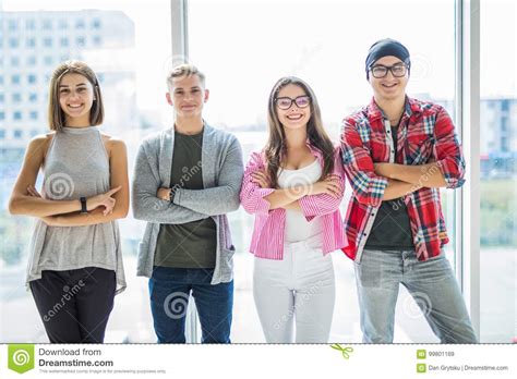 Group Of Four Happy Adult Friends Wearing Casual Clothing